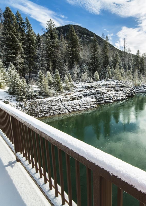 A view of the Flathead River and snow covered trees from the Old Belton Bridge