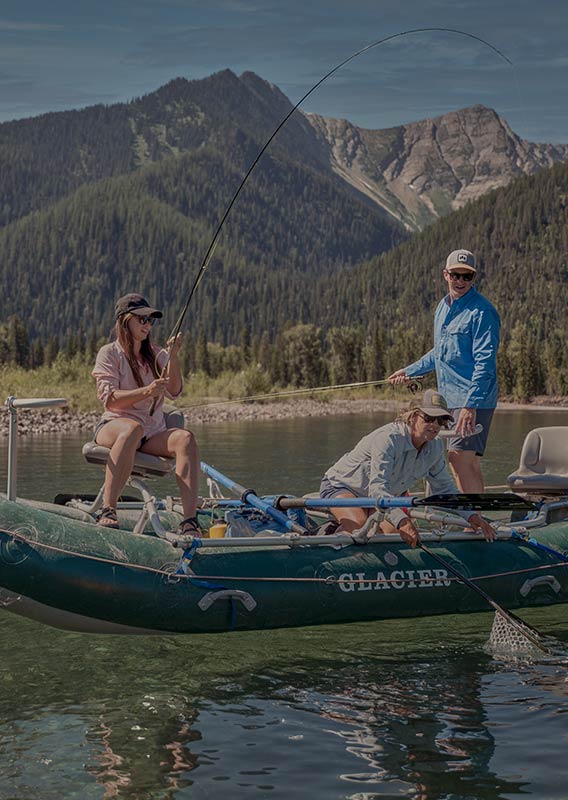 Three people on a boat fishing