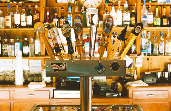 A set of beer taps at a bar