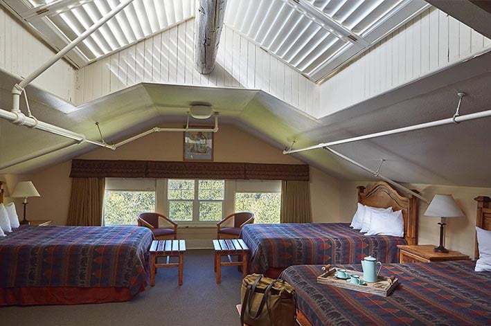 Main Lodge family room at Glacier Park Lodge with three queen beds