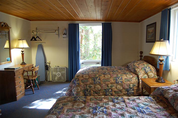 Motel Room at Motel Lake McDonald with two double beds and small desk
