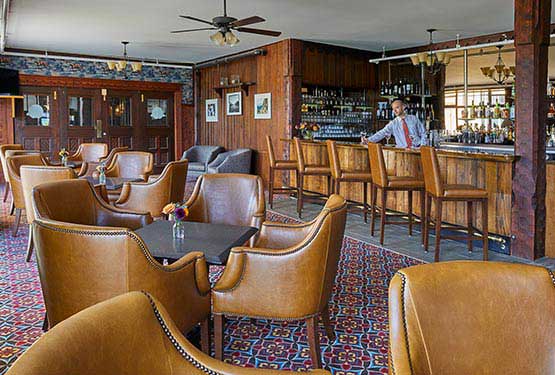 Leather lounge chairs in a hotel bar.