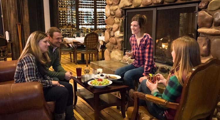 Group of guests gathering at the Fireplace