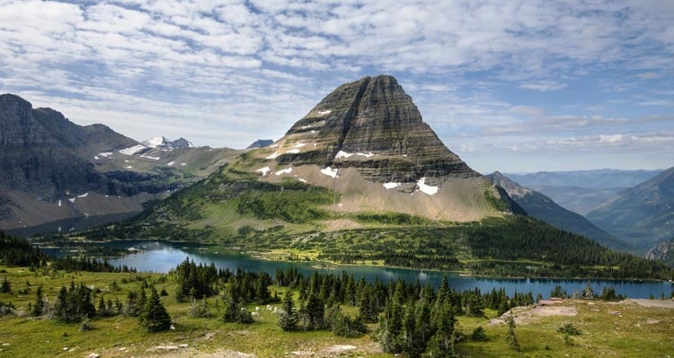 A flat-topped mountain rises directly above a blue lake
