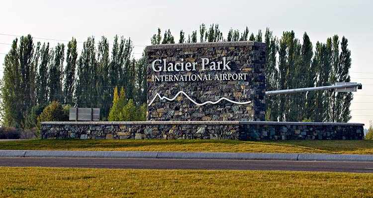 A stone sign for Glacier Park International Airport