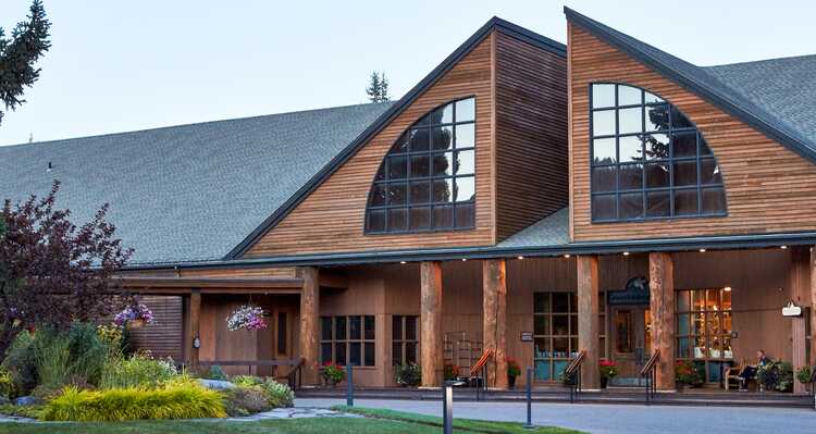 An exterior view of Grouse Mountain Lodge in the summer.