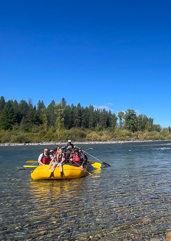 A group of rafters on shallow water.