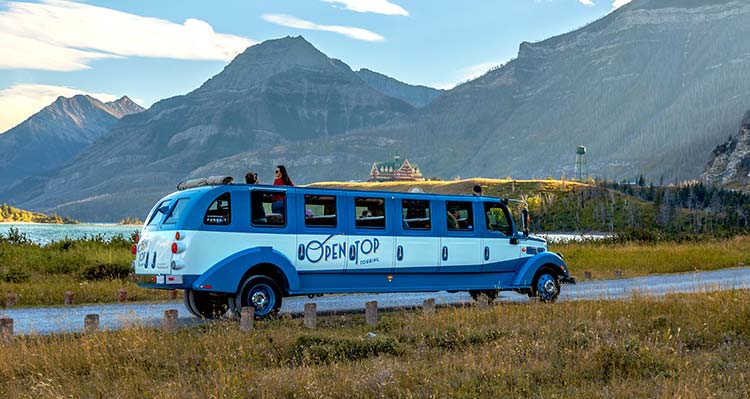 An Open Top Touring vehicle driving in Waterton