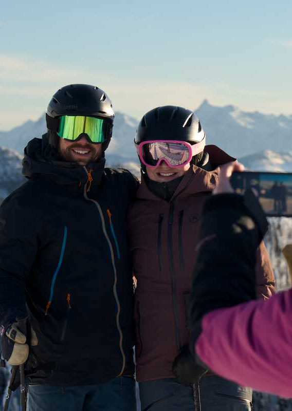 Grouse Mountain Lodge atop Whitefish Mountain sits amidst snow capped mountain peaks