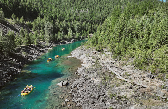 An aerial view of a rafting group floating down the Flathead River.
