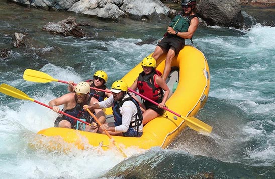 A sport raft in the water.