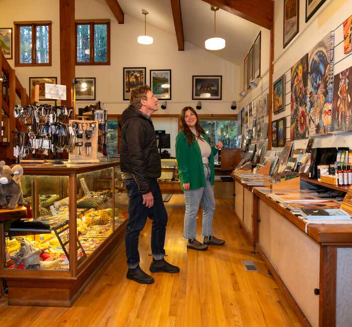 Two people look around a shop.
