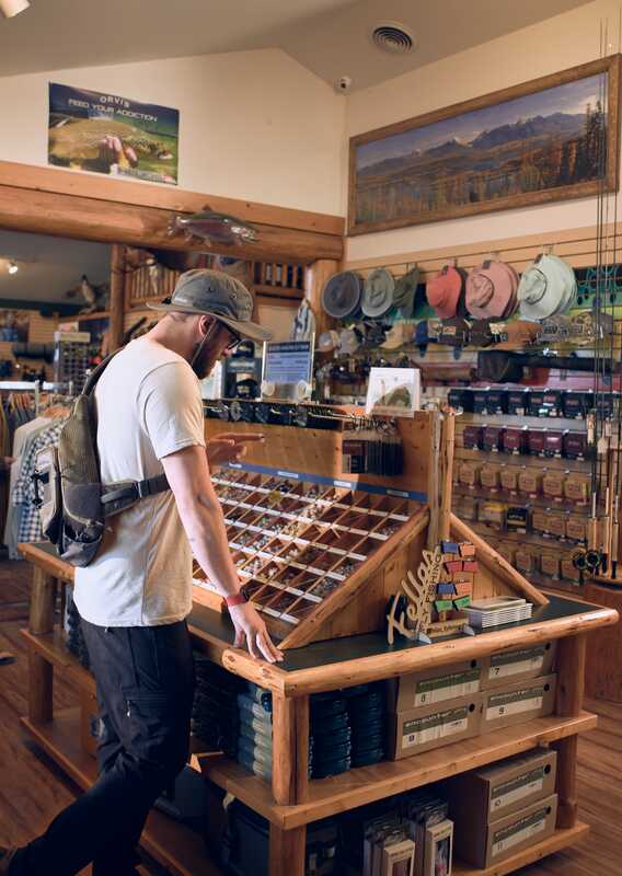 A person browsing items at a gift shop in Glacier National Park