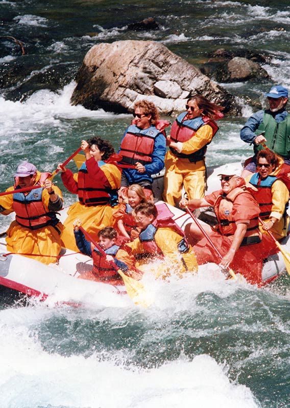 A group of rafters in a rapid.