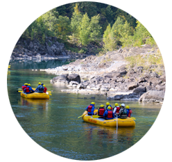 Two rafting groups floating along the Flathead River.