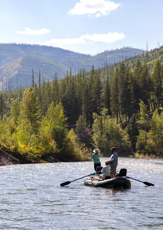 People fishing along the river in Glacier National Park