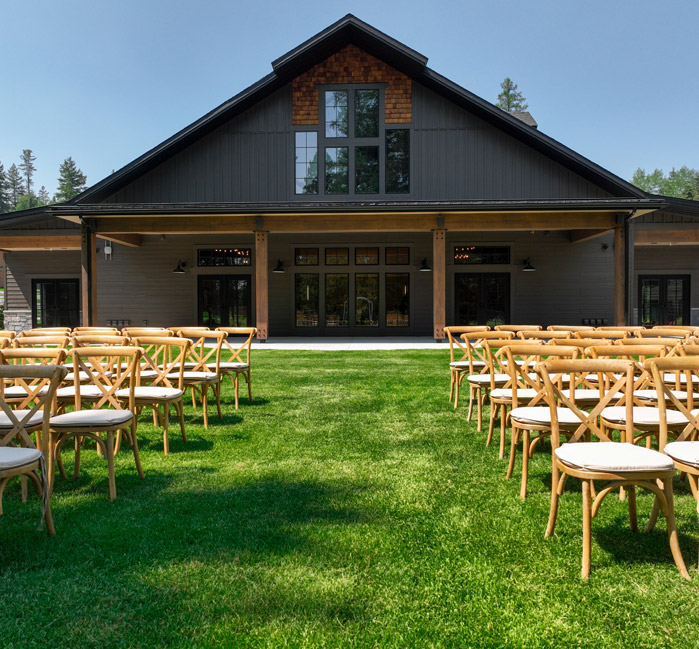 Front view of the exterior of an event center with outdoor seating.